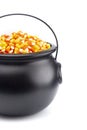 Black Cauldron For Witches FIlled with Candy Corn Royalty Free Stock Photo