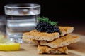 Black caviar on bread with dill Royalty Free Stock Photo