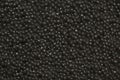 Black caviar close-up as a background. Texture of black caviar