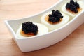 Black caviar on eggs