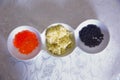 Black caviar, Red caviar, butter in a bowl Royalty Free Stock Photo