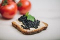 Black caviar on a slice of bread Royalty Free Stock Photo