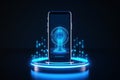 A black cell phone with a cylindrical attachment that projects a blue light sits on a reflective surface Royalty Free Stock Photo