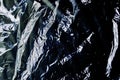 black cellophane bag close-up background texture of plastic Royalty Free Stock Photo