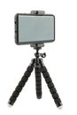 black cellphone in rugged rubber protective cover on small flexible tripod isolated on white