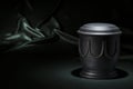 Black cemetery urn on deep green background Royalty Free Stock Photo