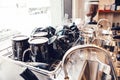 Black ceramic cups in coffee shop. Interior detail of local cafeteria restaurant with tea mugs and milk jugs. Toned with filters Royalty Free Stock Photo