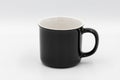 Black ceramic mug standing on white background Royalty Free Stock Photo