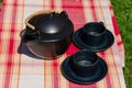 Black ceramic tea set on checked background Royalty Free Stock Photo