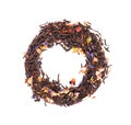 Black Ceylon tea with candied fruit, saffron, rose and cornflower petals, isolated on white background. Organic tea. Top view.