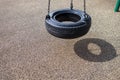 Black chain Tire Swing at a children`s  play ground no people Royalty Free Stock Photo