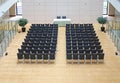 Black chairs in big empty room