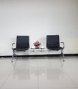 Black chairs in ordinary empty waiting room