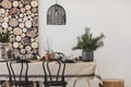 Black chairs and pendant lamp in dining room