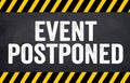 Black chalkboard with message This event is postponed Royalty Free Stock Photo