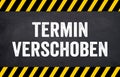 Black chalkboard with the german words for This event is postponed - Termin Event verschoben Royalty Free Stock Photo