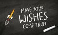 Black Chalkboard with pencil rocket and message Make your wishes come true