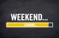 Black chalkboard with yellow loading bar and message weekend loading Royalty Free Stock Photo