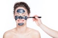 Black charcoal mask application on beautiful woman. Royalty Free Stock Photo