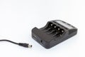 Black charger for AA and AAA batteries with unplugged cable.