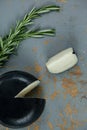 Black cheese with rosemary on wooden background