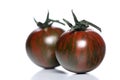 Black cherry tomatoes on white background Royalty Free Stock Photo