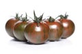 Black cherry tomatoes on white background Royalty Free Stock Photo