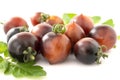 Black cherry tomatoes on a white background. Indigo tomatoes isolated Royalty Free Stock Photo