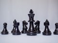 A black chess-Army is standing on white background, challenges planning business strategy to success concept