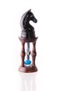 Black chess horse with sand-clock Royalty Free Stock Photo