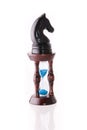 Black chess horse with sand-clock Royalty Free Stock Photo