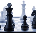 The black chess king.Blue toned Royalty Free Stock Photo