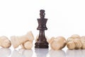 black chess king with fallen white pawns on white, Royalty Free Stock Photo