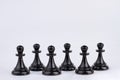 Black chess pawn figures isolated on white background. Royalty Free Stock Photo