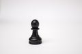 Black Chess piece white pawn on a white background Royalty Free Stock Photo