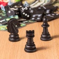 Black chess rook at the head of an bishop and a knight