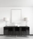 A black chest of drawers with metal legs with night lamps, vases and a picture above, mocap poster Royalty Free Stock Photo