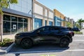 Black Chevy Blazer SUV in a parking lot