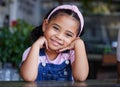 Black child, face and girl portrait with a smile, happiness and cute clothes with hands for headshot. Happy kid at a