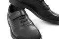 Black childrenÃ¢â¬â¢s leather shoes with a white background, isolate Royalty Free Stock Photo