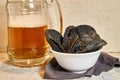 Black chips and beer. Alcoholic drink and snacks. Original beer snack. The chips with the addition of coal