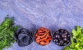 Black chips, sun-dried tomatoes and olives. Royalty Free Stock Photo