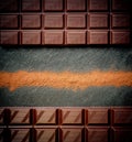 Black chocolate bar, cocoa powder Royalty Free Stock Photo