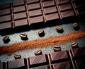 Black chocolate bar, coffee beans, cocoa powder Royalty Free Stock Photo