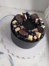 Black chocolate cake with oreo, chocolate and blueberry