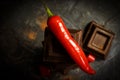 Black chocolate, red pepper delicious gourmet temptationÃÂ¼ spiciness on a dark background