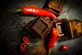 Black chocolate, red pepper temptationÃÂ¼ spiciness on a dark background