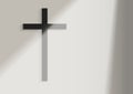 Black Christian Cross on the white wall background with window light and shadow Royalty Free Stock Photo