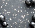 Black Christmas baubles with snow glitter shine, luxury brand winter holiday card