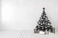 Black christmas tree in room, blank white wall, gifts. Royalty Free Stock Photo